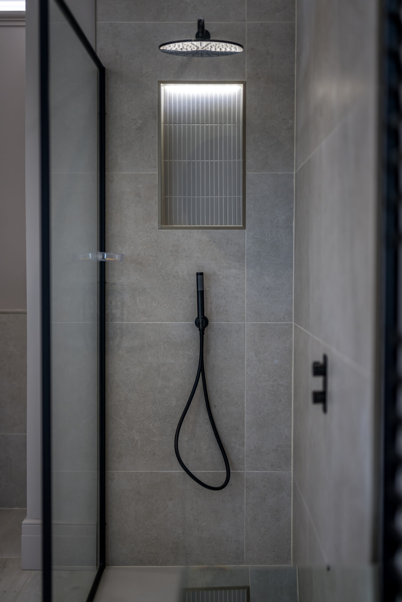 Matt Black Shower with Shower Niche tiled in greys