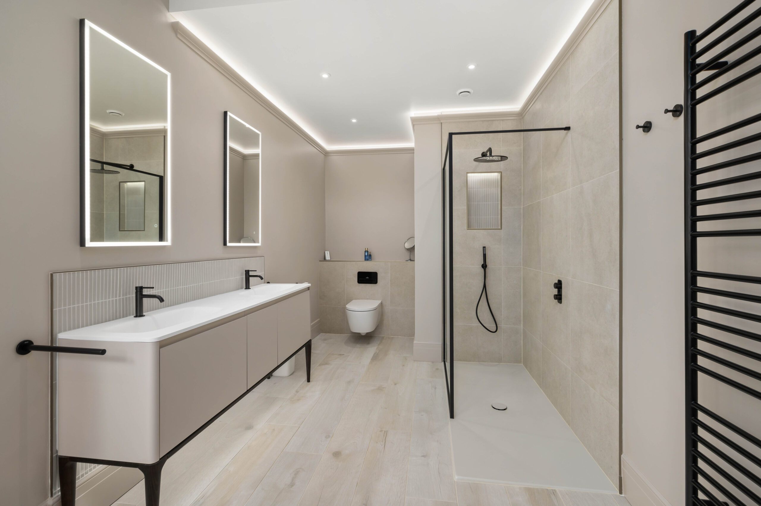 Light Coloured Bathroom Design with open shower area and two basins completed by Whytes