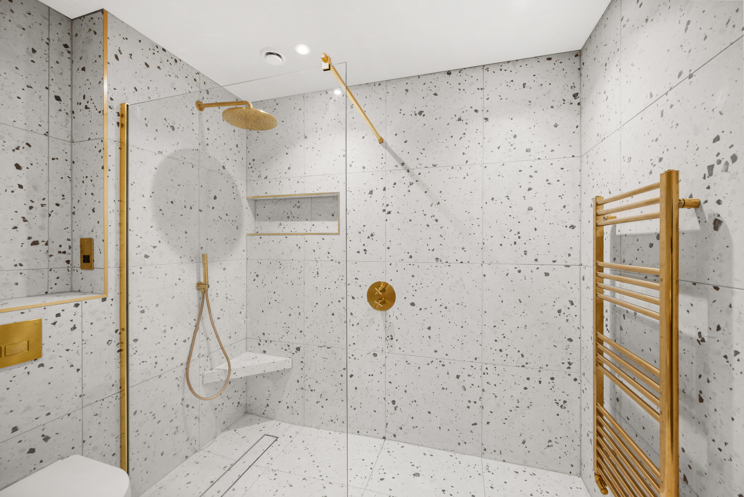 White Bathroom with Golden Brassware and Shower designed by Whytes