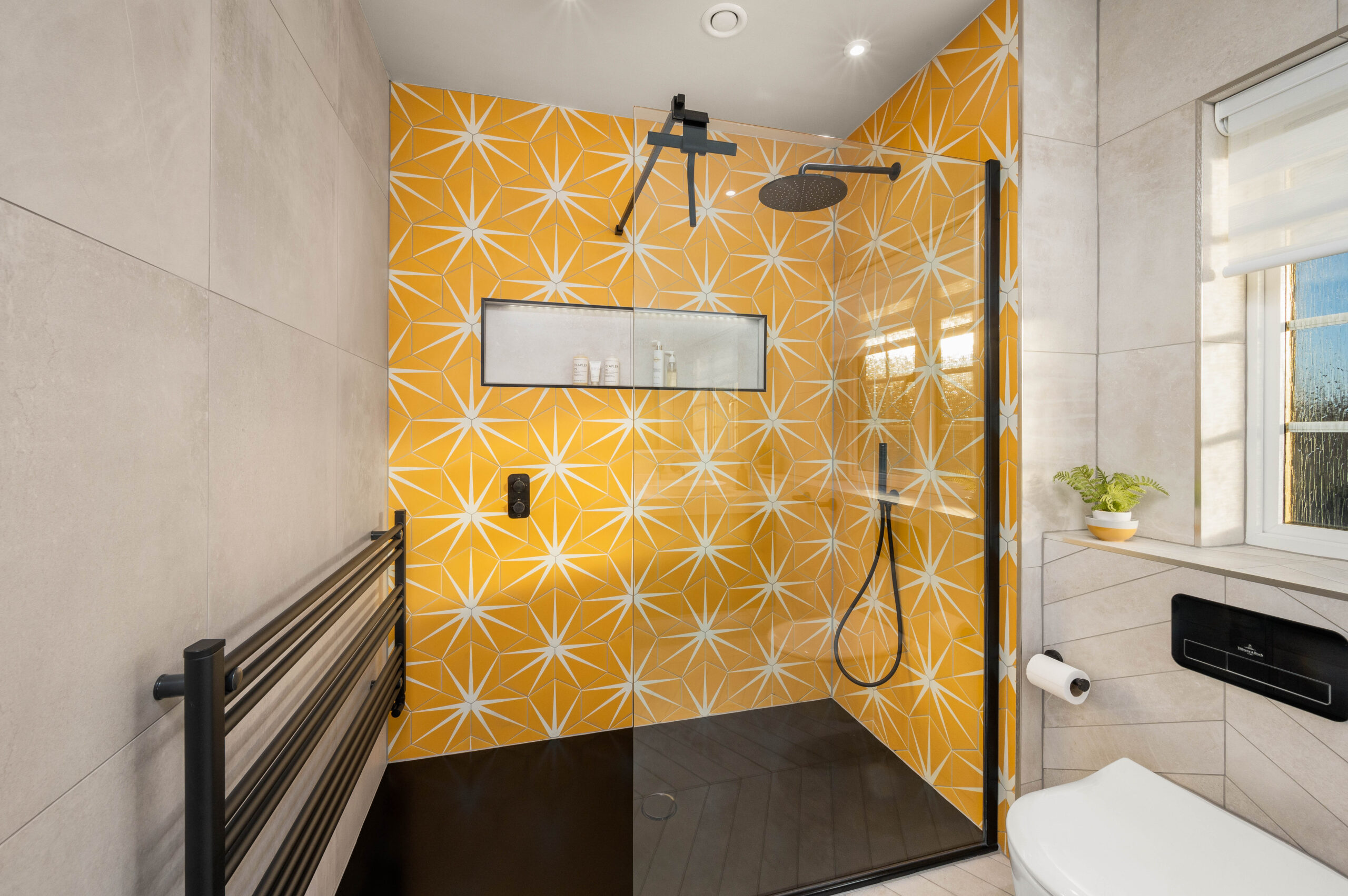 Project with yellow tiles in the shower area completed by Whytes